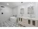 Contemporary bathroom with a soaking tub, dual sinks, and modern fixtures at 6486 Aquila Dr, Morrow, GA 30260