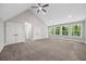 Spacious bedroom with multiple windows offering natural light and outdoor views at 6486 Aquila Dr, Morrow, GA 30260