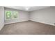 Spacious bedroom with a large window offering natural light at 6486 Aquila Dr, Morrow, GA 30260