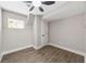 Bedroom with vinyl flooring and a window, offering a comfortable and well-lit space at 6486 Aquila Dr, Morrow, GA 30260