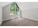 Bright bedroom with a large window offering views of the surrounding greenery at 6486 Aquila Dr, Morrow, GA 30260