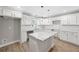 Stylish kitchen with white cabinets, granite countertops, stainless appliances, and a center island at 6486 Aquila Dr, Morrow, GA 30260