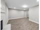 Open-concept living room with vinyl floors, featuring a fireplace and ample space at 6486 Aquila Dr, Morrow, GA 30260