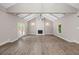 Bright living room with a cozy fireplace, vaulted ceiling, and wood floors at 6486 Aquila Dr, Morrow, GA 30260