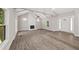Open living room with fireplace, wood floors, and natural light at 6486 Aquila Dr, Morrow, GA 30260