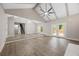 Spacious living room featuring wood floors, vaulted ceilings and backyard views through french doors at 6486 Aquila Dr, Morrow, GA 30260