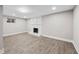 Spacious living room with light vinyl flooring and a decorative fireplace at 6486 Aquila Dr, Morrow, GA 30260