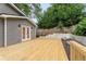Back deck area with landscaping and mature trees at 814 S Mcdonough St, Decatur, GA 30030