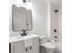 Modern bathroom features sleek fixtures, tile flooring, a marble vanity, and matte black hardware at 814 S Mcdonough St, Decatur, GA 30030