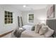 Bright bedroom with windows, hardwood floors, and neutral decor at 814 S Mcdonough St, Decatur, GA 30030