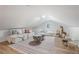 Bright bonus room with sloped ceilings and cozy seating at 814 S Mcdonough St, Decatur, GA 30030