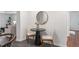Cozy dining area is staged with trendy round mirror and chairs at 814 S Mcdonough St, Decatur, GA 30030