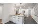 This kitchen is open and spacious, featuring an island and modern light fixtures at 814 S Mcdonough St, Decatur, GA 30030