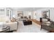 This spacious living room boasts natural light and neutral tones for a warm ambiance at 814 S Mcdonough St, Decatur, GA 30030