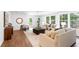 Bright living room with large windows and neutral furniture at 814 S Mcdonough St, Decatur, GA 30030