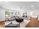 Open living area features neutral colors, large windows and hardwood flooring at 814 S Mcdonough St, Decatur, GA 30030