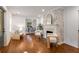 Bright living room boasts a decorative brick fireplace, hardwood floors, and stylish, comfortable seating at 814 S Mcdonough St, Decatur, GA 30030