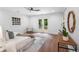 Bright main bedroom features wood floors, patio access, modern decor, and plenty of natural light at 814 S Mcdonough St, Decatur, GA 30030