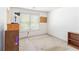 Bedroom with a desk, dresser, and a window, plus some decorations at 11885 Carriage Park Ln, Duluth, GA 30097