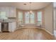 Cozy dining area adjacent to the kitchen featuring natural light and neutral finishes at 1904 Watercrest Cir, Lawrenceville, GA 30043