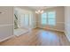 Bright dining area featuring wood floors and a chandelier at 1904 Watercrest Cir, Lawrenceville, GA 30043