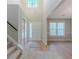 Spacious entry foyer with wood floors and access to the upper level of the home at 1904 Watercrest Cir, Lawrenceville, GA 30043