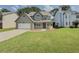 Traditional home with a lawn and driveaway and porch at 1904 Watercrest Cir, Lawrenceville, GA 30043