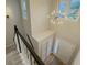 Bright two-story foyer with chandelier lighting, entry door and stairway to the second floor at 1904 Watercrest Cir, Lawrenceville, GA 30043