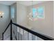 Foyer with stylish chandelier lighting, stairway with stained wood railing, and natural light at 1904 Watercrest Cir, Lawrenceville, GA 30043