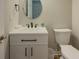 Well-lit half bath with modern vanity, fixtures, and finishes at 1904 Watercrest Cir, Lawrenceville, GA 30043
