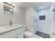 Updated bathroom featuring a white vanity with quartz countertop and a tiled walk-in shower at 1914 North Nw Ave, Atlanta, GA 30318