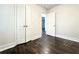 Bright bedroom with closet doors and dark wood floors, ready for customization at 1914 North Nw Ave, Atlanta, GA 30318
