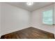 Bedroom with hardwood flooring, white walls, one window and white trim at 1914 North Nw Ave, Atlanta, GA 30318