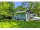 Side view of a cozy home with light blue siding and a well-maintained lawn at 1914 North Nw Ave, Atlanta, GA 30318