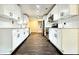Spacious kitchen featuring white cabinets, subway tile backsplash, and hardwood floors, perfect for cooking and entertaining at 1914 North Nw Ave, Atlanta, GA 30318