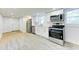 Kitchen with stainless steel appliances and white cabinetry, with stainless steel oven and microwave at 1914 North Nw Ave, Atlanta, GA 30318