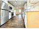 Modern kitchen with stainless steel appliances, white cabinetry, and hardwood flooring throughout the open-concept space at 1914 North Nw Ave, Atlanta, GA 30318