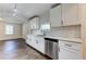 The updated kitchen showcases white cabinets, stainless steel appliances, and lots of light at 1914 North Nw Ave, Atlanta, GA 30318