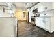 Well-lit kitchen features stainless steel appliances, white cabinetry, and a modern design at 1914 North Nw Ave, Atlanta, GA 30318