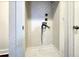 A functional laundry area with tile flooring and essential hookups for washer and dryer installations at 1914 North Nw Ave, Atlanta, GA 30318
