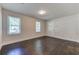 Bright living room featuring hardwood floors, white walls, and natural light from two windows at 1914 North Nw Ave, Atlanta, GA 30318