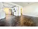 Open-concept living area with hardwood flooring, flowing seamlessly into a modern kitchen and dining space at 1914 North Nw Ave, Atlanta, GA 30318