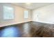Bright living room with hardwood floors, a large window offering natural light, and neutral walls for versatile decor at 1914 North Nw Ave, Atlanta, GA 30318