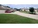 Serene street view showcasing well-manicured lawns and beautiful single-story homes at 245 Fenwick Cir, Mcdonough, GA 30253