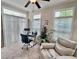 Bright sun room featuring carpet, neutral paint, lots of light, and a comfortable seating area at 245 Fenwick Cir, Mcdonough, GA 30253