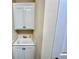 Mud room with white cabinets and utility sink at 245 Fenwick Cir, Mcdonough, GA 30253