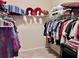 Ample storage with organized walk-in closet featuring metal shelving and clothing at 245 Fenwick Cir, Mcdonough, GA 30253