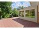 Brick patio extending from sunroom, green backyard with storage shed at 2826 Summit Ridge Dr, Marietta, GA 30066