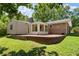 Spacious brick patio and landscaped backyard with a sunroom at 2826 Summit Ridge Dr, Marietta, GA 30066