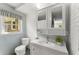 Bright bathroom features tile accents, updated vanity, and a large mirror at 2826 Summit Ridge Dr, Marietta, GA 30066